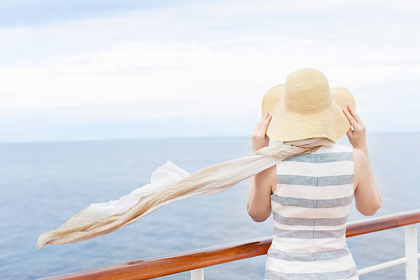 woman at cruise ship back view of young woman enjoying cruise cruise ship people stock pictures, royalty-free photos & images