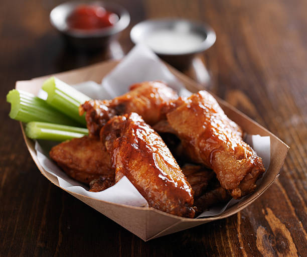 istock bbq chicken wings with sauces 533376401