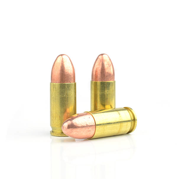 istock 9mm bullet for a gun isolated on white background. 533377001