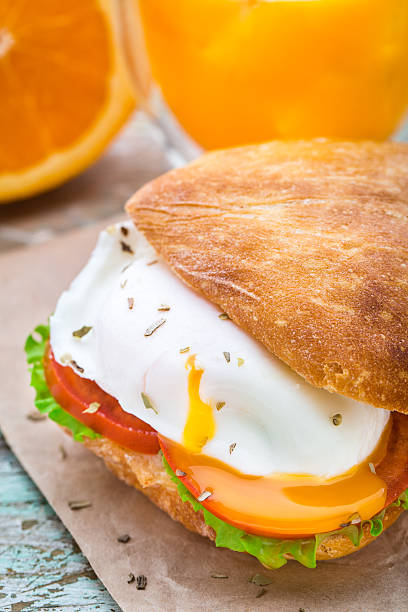 Burger with pouched egg and tomato