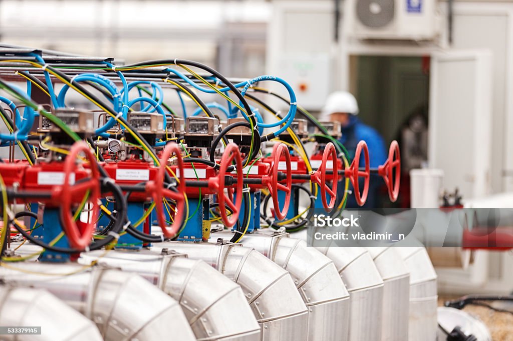 oil refinery detail of oil pipeline with valves in large oil refinery 2015 Stock Photo