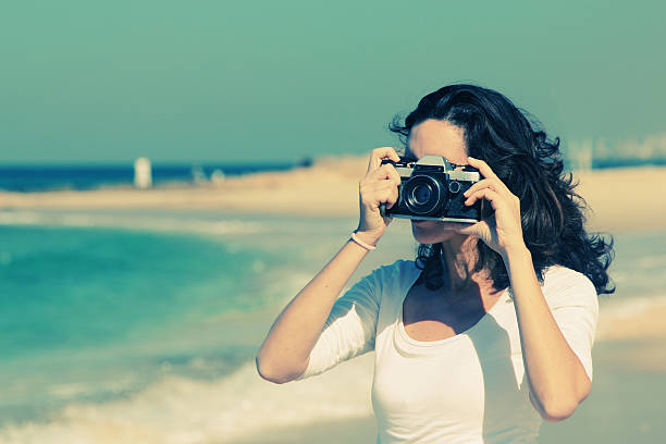 istock Woman with vintage retro camera 533380661