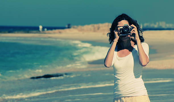istock Woman with vintage retro camera 533380663