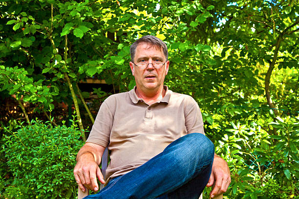 istock man sitting in his garden 533380725