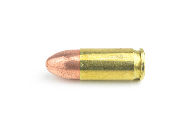 istock 9mm bullet for a gun isolated on white background. 533381059