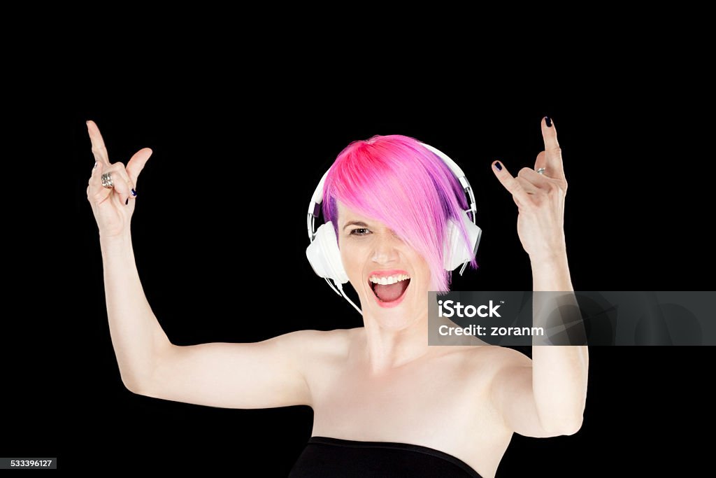 Singing Beautiful woman with headphones on singing, copy space 2015 Stock Photo