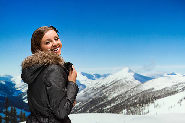 istock Cheerful woman in the snow 533396413