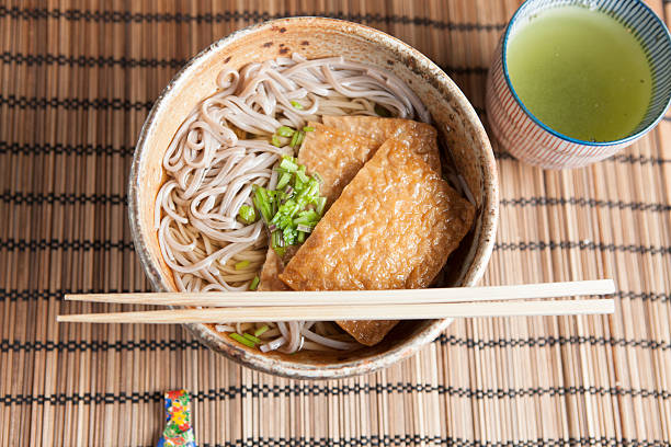 istock Kitsune soba, Japanese buckwheat noodles with marinated, fried tofu 533397007