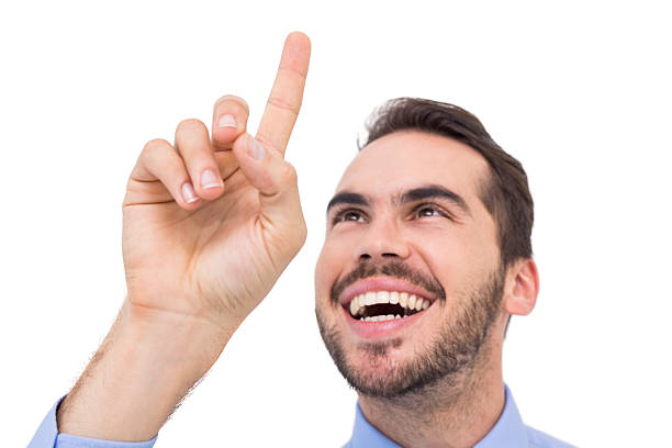 istock Happy businessman pointing something up 533397097