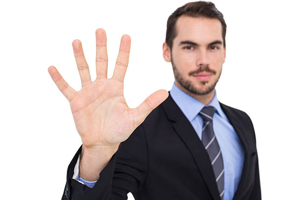 istock Smiling businessman with fingers spread out 533397119
