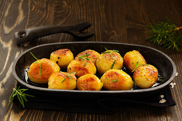 istock Baked potatoes with rosemary. 533397327
