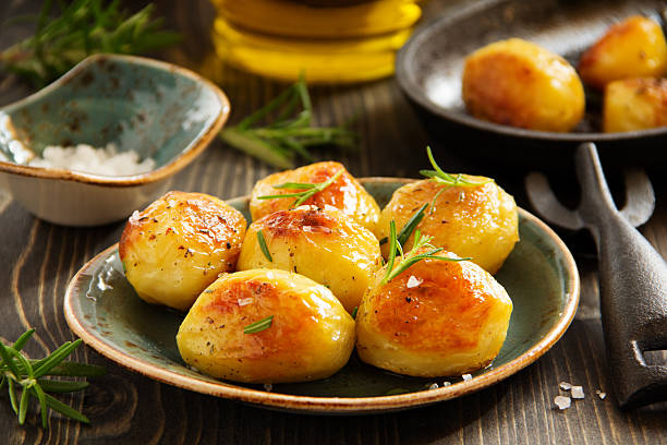 istock Baked potatoes with rosemary. 533397329