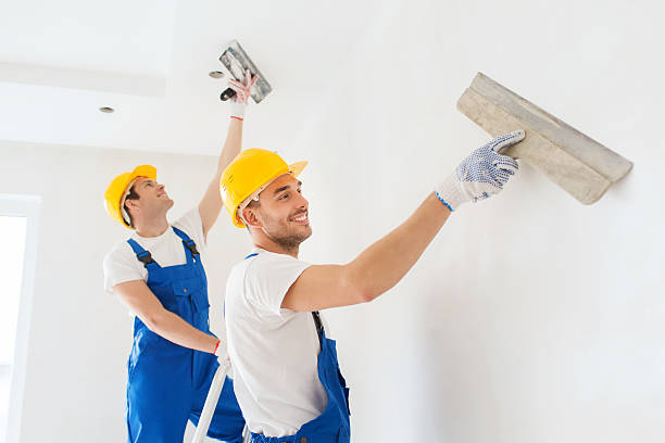 istock group of builders with tools indoors 533398045