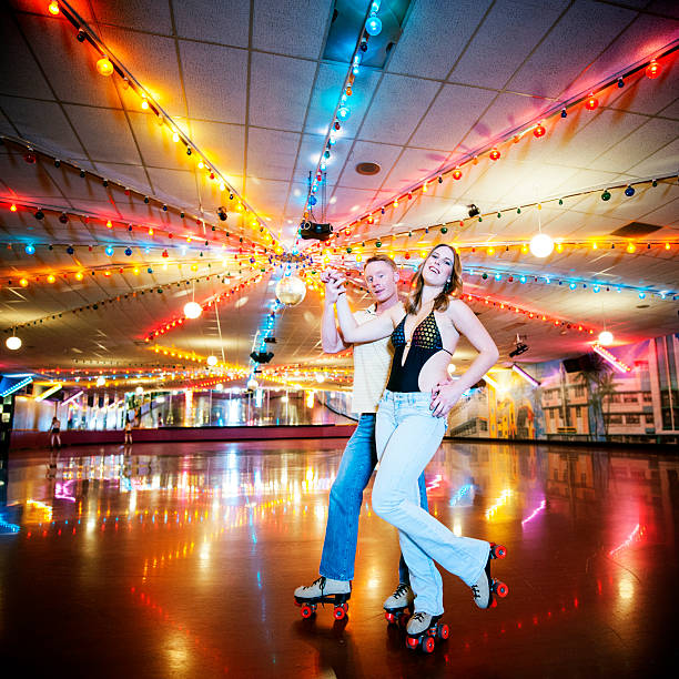 istock Young Man and Woman Retro Roller Skating. 533398769