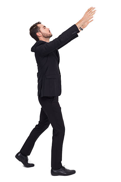 istock Businessman with arms raised catching something 533399493