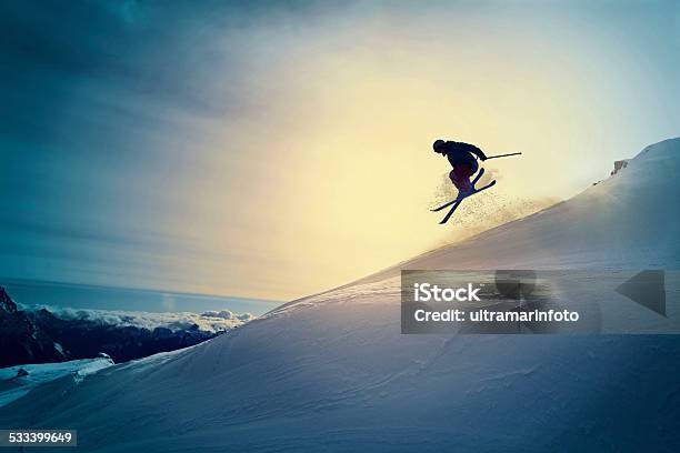 Extreme Freestyle Snow Skier Jumping Off Pist Back Country Skiing Stock Photo - Download Image Now