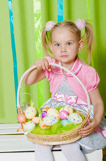 istock Little girl with  basket with Easter eggs 533400163
