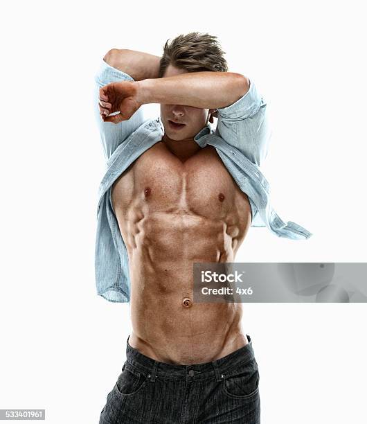 Muscular Man Posing Stock Photo - Download Image Now - 20-24 Years, 20-29 Years, 2015