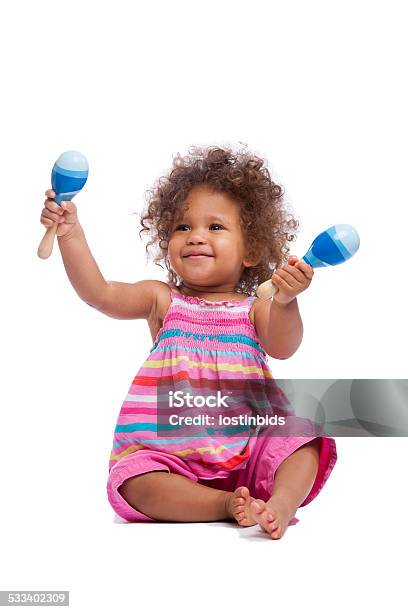 Biracial Baby Girl Toddler Waving Her Maracus Isoltated On White Stock Photo - Download Image Now