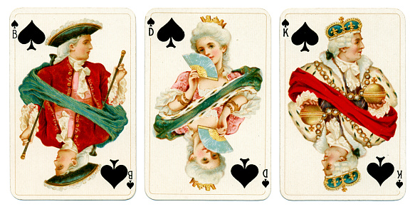 These are the court cards / picture cards from the spades suit of Dondorf playing card pack No. 161, which carries the 'Baronesse' pattern on the reverse. These cards are printed using chromolithography by Bernhard Dondorf of Frankfurt aM in about 1900. Baronesse was a popular design that first appeared in 1892. These court / picture cards all show figures wearing white powdered wigs and velvet clothing. The letter 'B' stands for 'Bube', a rogue or knave, although in this case the figure is more in the nature of a nobleman. The Queen bears the letter D for Dame, while the King has a K for Konig. This particular deck comprises 32 cards for the game of Piquet, made up of the seven through King plus Ace of each suit. Piquet was one of the most popular card games of the 18th and 19th centuries.