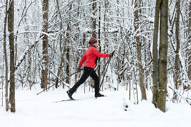 Woman cross-country skiing, snow, winter sport. stock photo