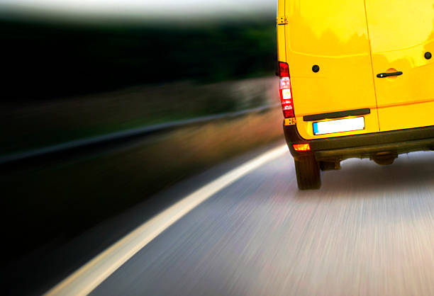 istock Yellow Van on the road - motion blurred 533419011