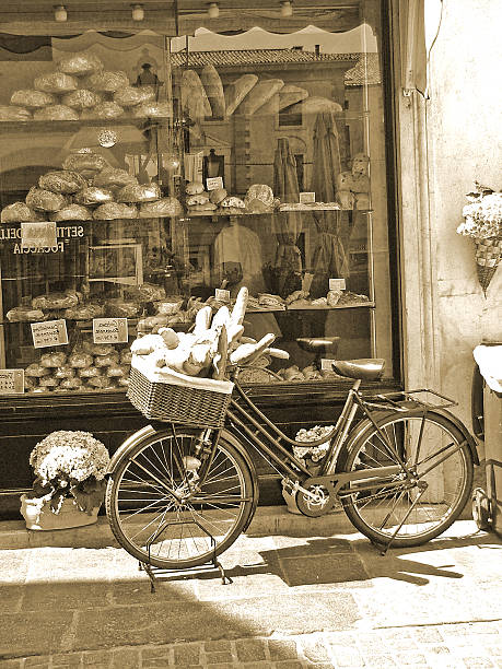 Different types of bread in a cart under warm light