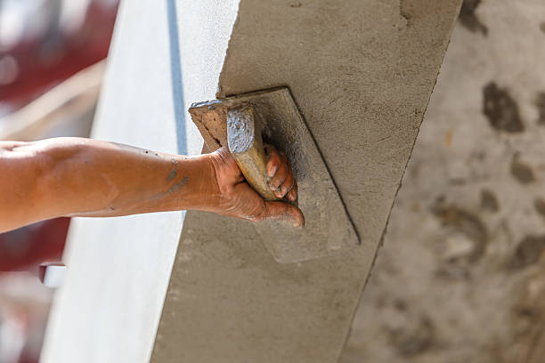 istock plasterer concrete on wall of house construction 533419245