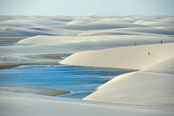 Lencois Maranhenses National Park, Brazil Lencois, Maranhao, Brazil - August 21, 2010: Lencois Maranhenses National Park, located in northeastern Brazil, low, flat, occasionally flooded land, overlaid with large, discrete sand dunes with blue and green lagoons brazil desert maranhao state national park stock pictures, royalty-free photos & images