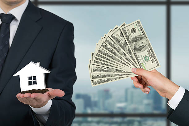 istock giving money for housing 533422125