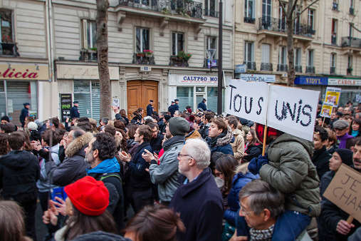 Paris, France - January 11, 2015: People applauding Police officers during the anti-terrorism rally in Paris.