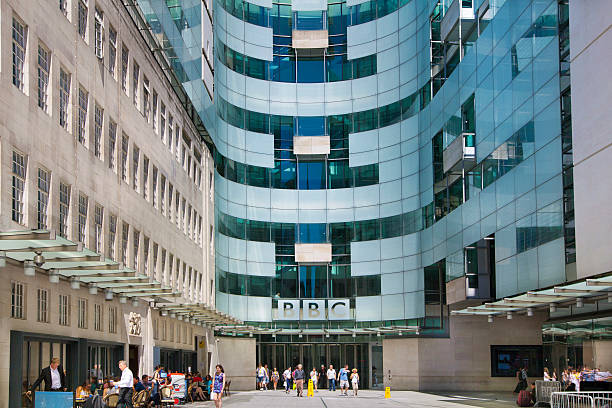 BBC head office, London London, UK - July 3, 2014:  BBC head office and square in front of main entrance with walking people bbc photos stock pictures, royalty-free photos & images