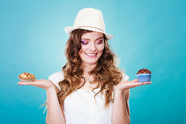 istock Smiling summer woman holds cakes in hand 533429104