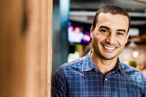 istock Handsome mid adult man smiling in cafe 533429834
