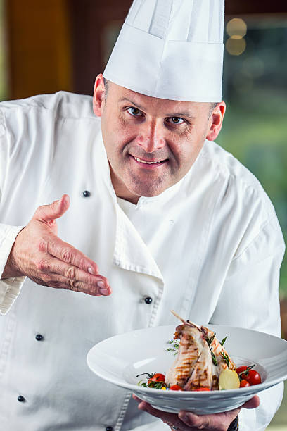 istock Chef. Chef cooking.Chef decorating dish. Chef preparing a meal. 533432706