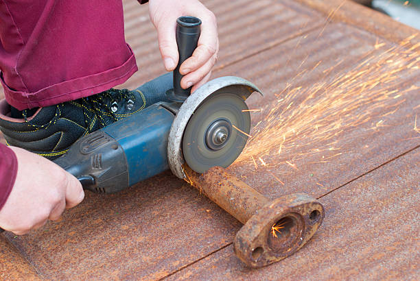 istock Mechanic power saw cuts a metal pipe. 533435106