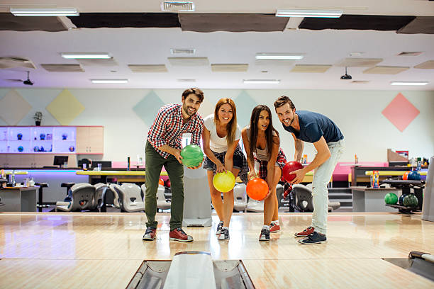istock Smiling Friends Bowling Together 533435398