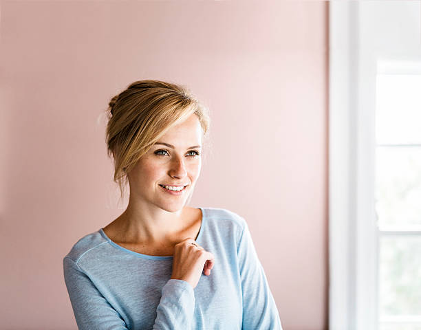 istock Happy young woman in brightly lit home 533437242