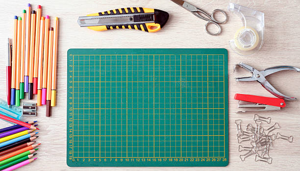 header02 Desktop mockup, top view, with colorful stationery and central copy space, on wooden background stapled paper stock pictures, royalty-free photos & images