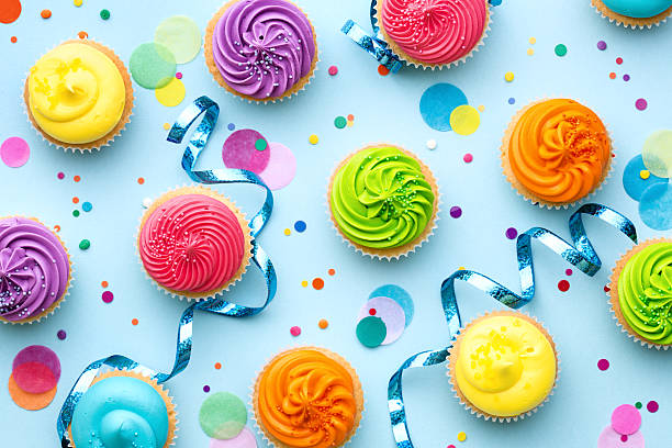 Colorful cupcake party background Colorful cupcake party background on blue birthday cake photos stock pictures, royalty-free photos & images