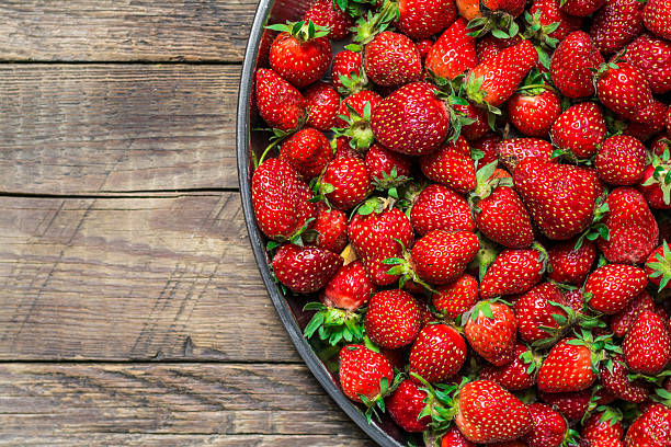 istock Strawberry on wood background 533437602