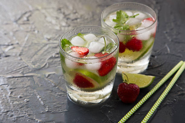 Refreshing summer cocktail with lime, strawberry and mint. Mojito cocktail, selective focus