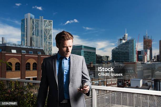 Outdoor Portrait Of Businessman Using Smart Phone Stock Photo - Download Image Now - 2015, Adult, Adults Only