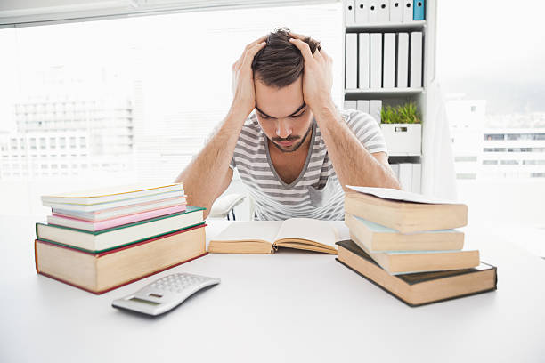 istock Stressed casual businessman studying at his desk 533440351