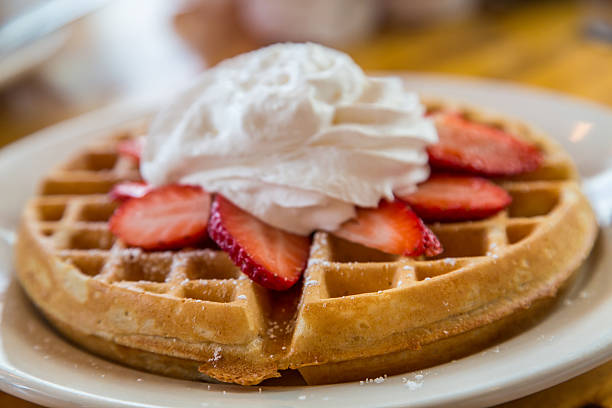 istock Waffle Topped with Strawberries and Whipped Cream 533440697