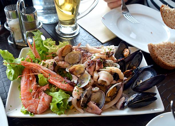 istock Fresh seafood cocktail on a white bowl 533441044