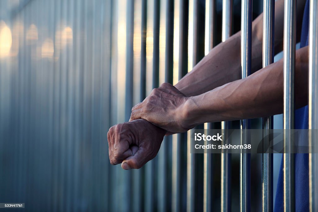 hand in jail Criminal Stock Photo