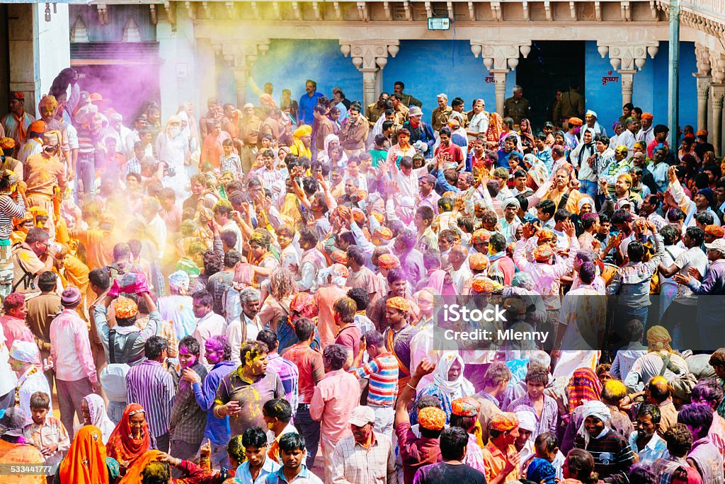 Celebrating Crowd Holi Festival India Large crowd of people, paint covered individuals enjoying and celebrating at the Holi Festival, Barsana, Rajasthan, India. Holi Stock Photo