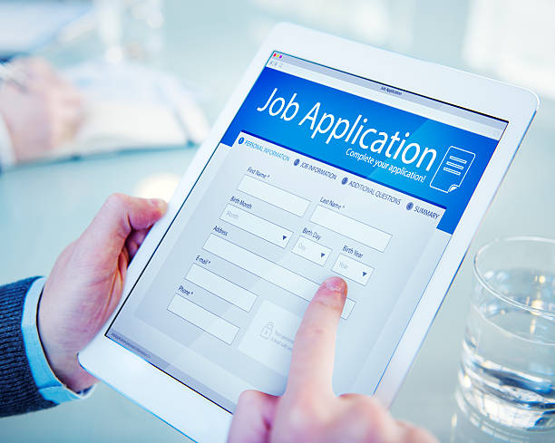 applicant filling up the online job application - ansökningsblankett bildbanksfoton och bilder