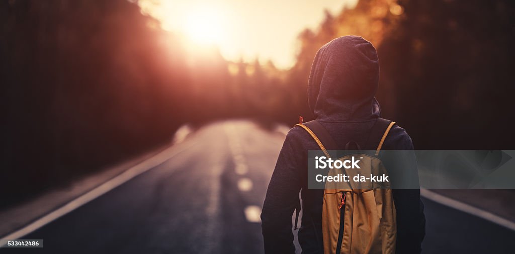 Traveler Walking Forward Alone At Sunset Stock Photo - Download Image Now -  Backpack, Women, Road - iStock